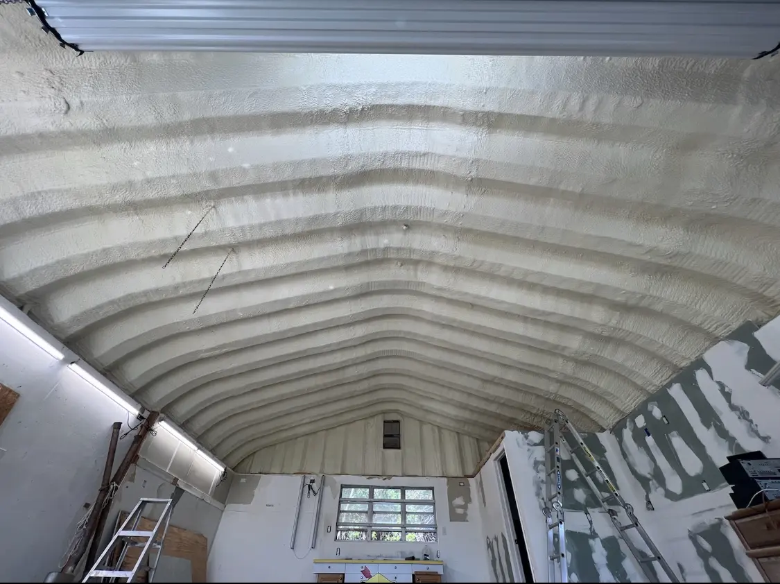 Spray polyurethane foam applied to the underside of a metal roof deck in Pineville